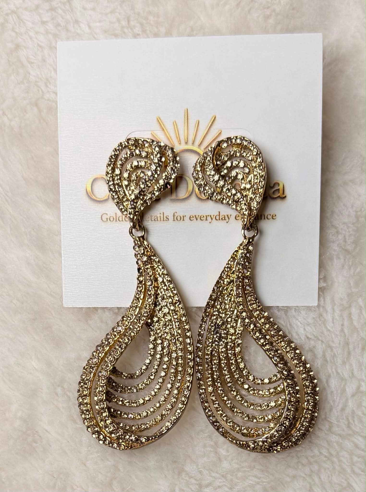 Gold Crystal Teardrop Swirl Statement Earrings
